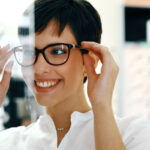 woman trying on glasses